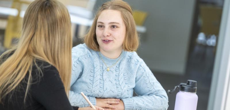 Two students sitting at table 