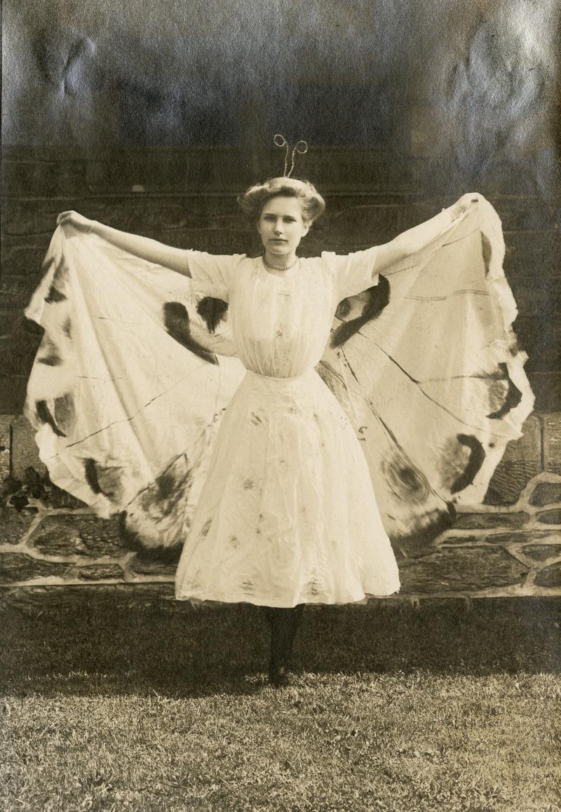 Class of 1912 student dressed as butterfly, their class animal, likely for the Freshman Show.